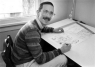 Here's a black & white photo of Watterson at his drawing desk. (Circa 1980-?)
